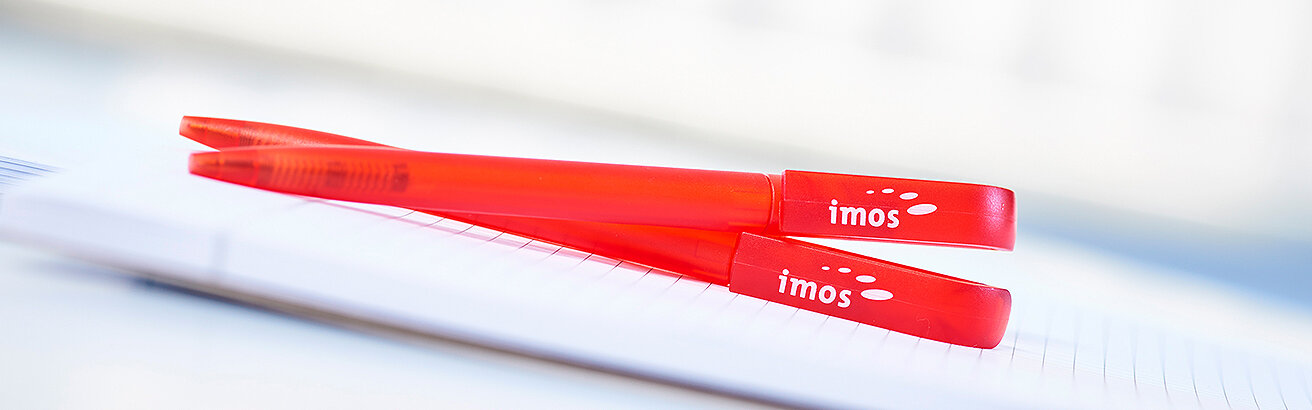 rote imos Kugelschreiber auf Block 